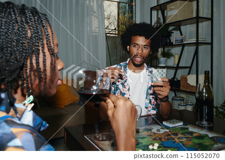 Boyfriend and Girlfriend Playing Board Game Boyfriend and Girlfriend Playing Board Game 115052070