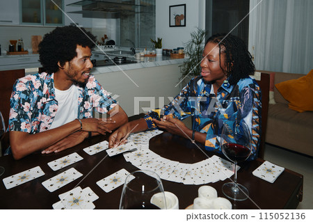 Woman Spreading Tarot Cards for Boyfriend 115052136