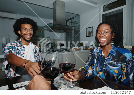 Friends Toasting with Wine Glasses 115052147