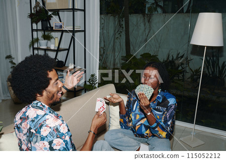 Couple Playing Cards after Work Couple Playing Cards after Work 115052212