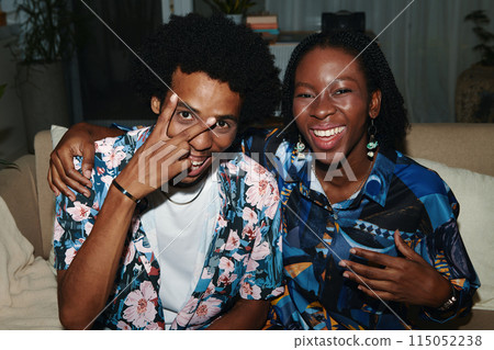Cheerful Couple in Floral Shirts 115052238