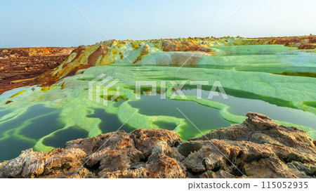 Colorful green volcanic lake terraces and yellow sulphur minerals, Danakil Depression desert, Afar region, Ethiopia Colorful green volcanic lake terraces and yellow sulphur minerals, Danakil Depression desert, Afar region, Ethiopia 115052935