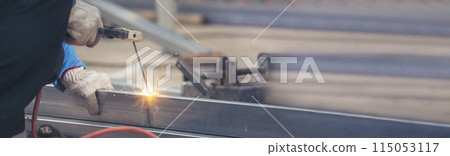 Banner Men hands wear protective glove Hot flame metal work cut fire iron workshop. Locksmith cut metal process. Construction Worker hands using Welding machinery iron metal sparking with copy space 115053117