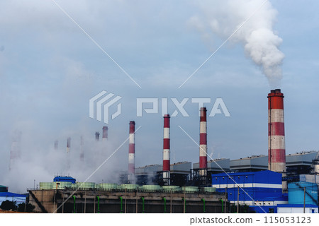 Power stations manufacturing electrical industrial plant. Electric power building refinery engineering smog steam smokestack. Lignite electricity chimneys release pollution in industry plant blue sky 115053123