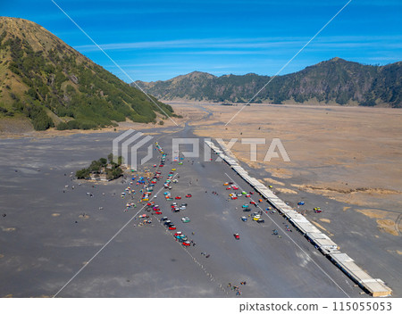 Aerial view of adventure tourist car for mountain Bromo vocalno viewpoint in parking area, Indonesia Aerial view of adventure tourist car for mountain Bromo vocalno viewpoint in parking area, Indonesia 115055053