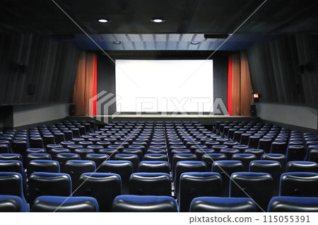 A movie theater with a movie screen A movie theater with a movie screen 115055391