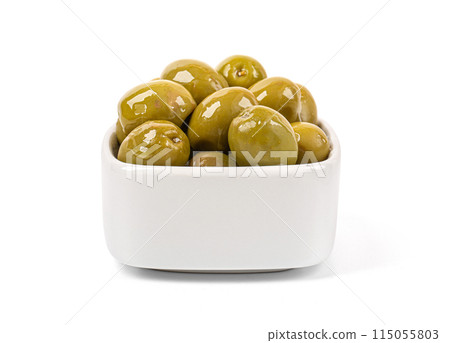 Green olives, in a white bowl 115055803