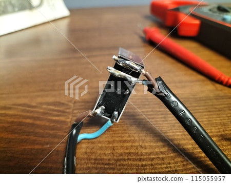 Sealed contacts of the regulator relay with stripped copper ends of the wire. Repairing electrical equipment, with your own hands with a soldering household appliance at home, restoring performance. Sealed contacts of the regulator relay with stripped copper ends of the wire. Repairing electrical equipment, with your own hands with a soldering household appliance at home, restoring performance. 115055957