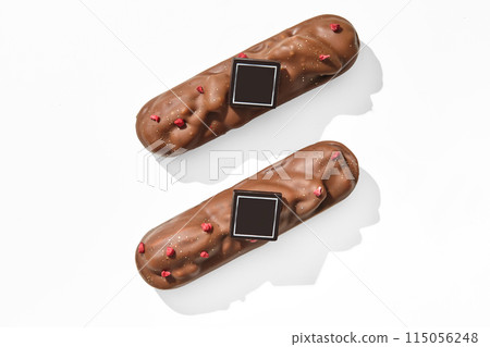 Milk chocolate-covered pecan bars with dried berries 115056248