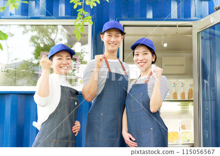 A sales staff member at a gelato shop looks at you with a smile 115056567