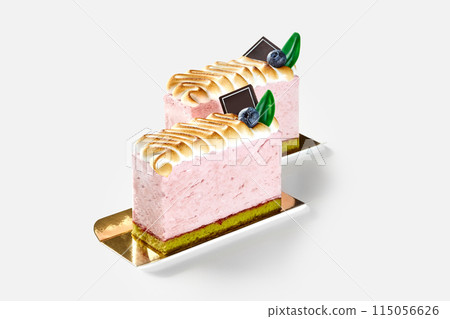 Berry mousse desserts with pistachio sponge cake and toasted meringue 115056626