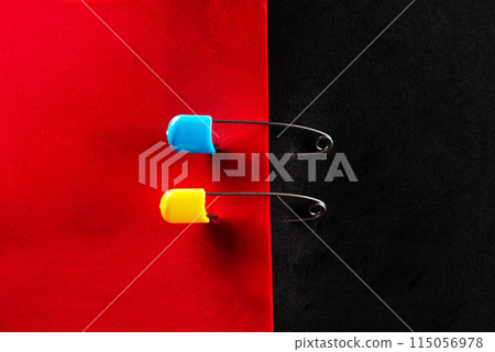 Ukrainian symbols. Red and black flag. Red and black leaf. Yellow and blue pins. 115056978