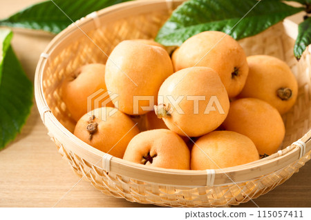 Large loquats in a basket Large loquats in a basket 115057411