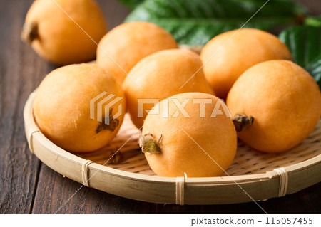 Large loquats served in a colander 115057455