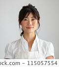 A woman in an apron 115057554
