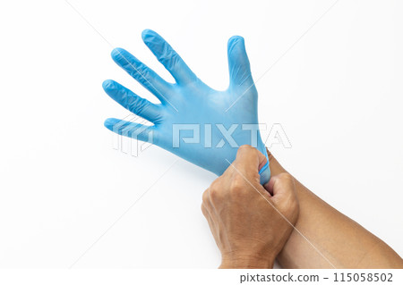 Male hand wearing rubber glove 115058502
