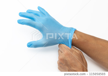 Male hand wearing rubber glove 115058503