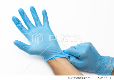 Male hand wearing rubber glove 115058504