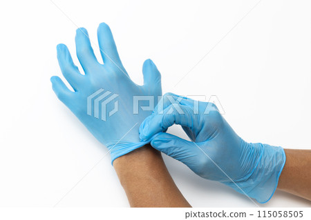 Male hand wearing rubber glove 115058505