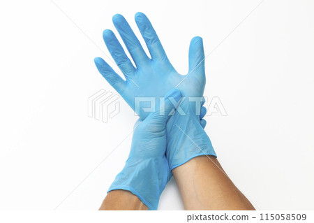 Male hand wearing rubber glove 115058509