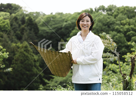 Cute woman enjoying country life Cute woman enjoying country life 115058512