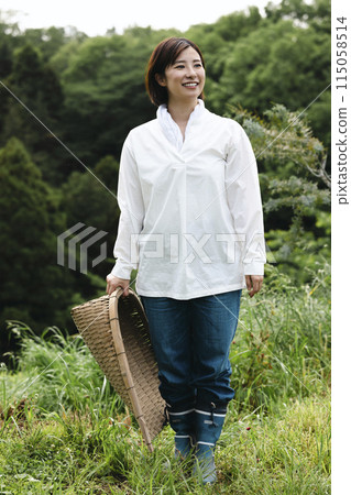 Cute woman enjoying country life Cute woman enjoying country life 115058514