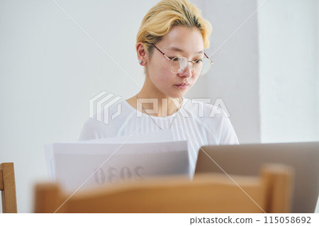Woman doing work at home 115058692