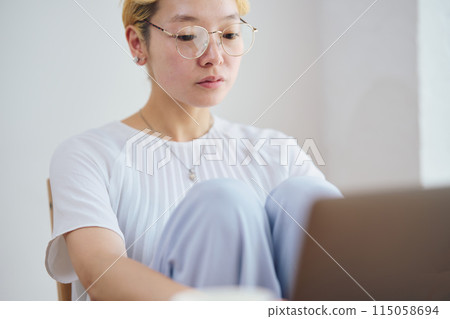 Woman doing work at home Woman doing work at home 115058694