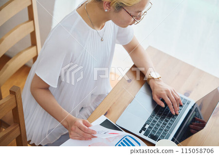 Woman doing work at home 115058706