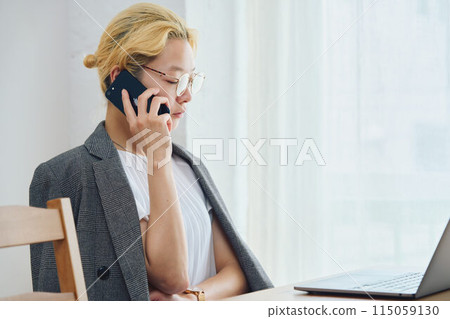 Woman doing work at home Woman doing work at home 115059130