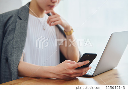 Woman doing work at home 115059143