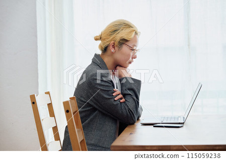 Woman doing work at home 115059238