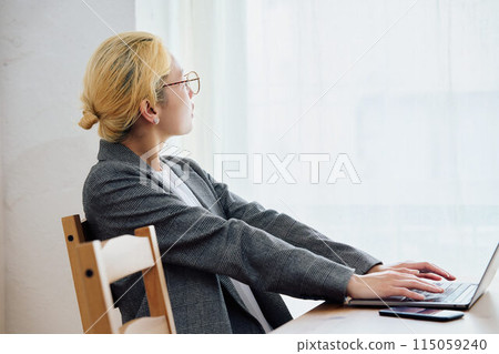 Woman doing work at home Woman doing work at home 115059240