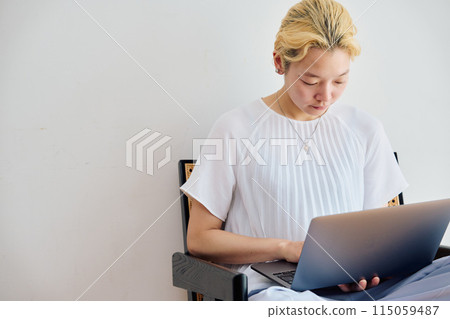 A woman working at home at home A woman working at home at home 115059487