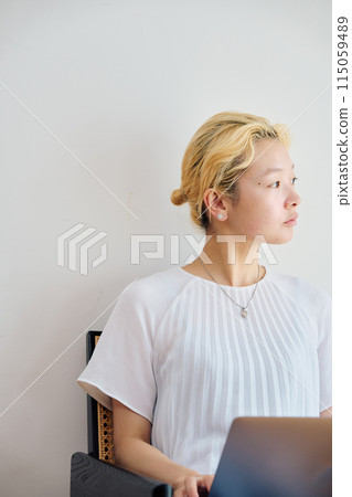 A woman working at home at home A woman working at home at home 115059489