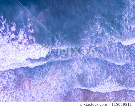 Amazing Top view sea beach landscape background,Summer sea waves crashing on sandy shore seascape background,High angle view ocean nature background 115059811