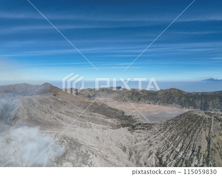 Aerial view Mountains at Bromo volcano during sunny sky,Beautiful Mountains Penanjakan in Bromo Tengger Semeru National Park,East Java,Indonesia.Nature landscape background 115059830