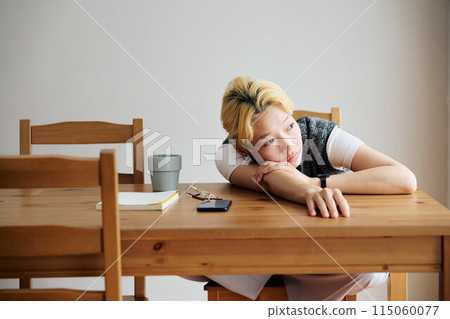 A woman relaxing in the room 115060077
