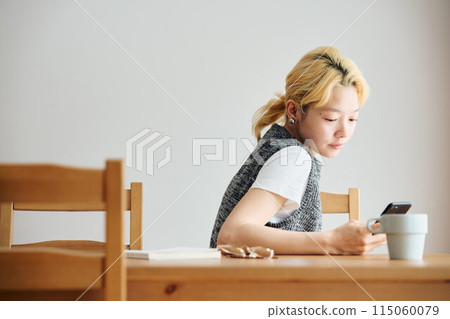 A woman relaxing in the room 115060079