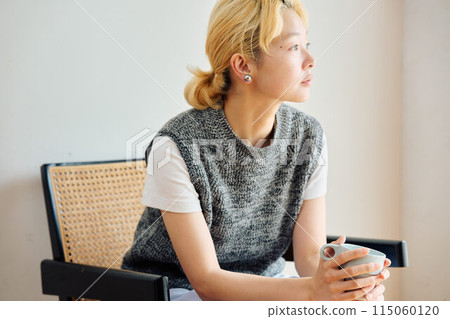 A woman relaxing in the room A woman relaxing in the room 115060120