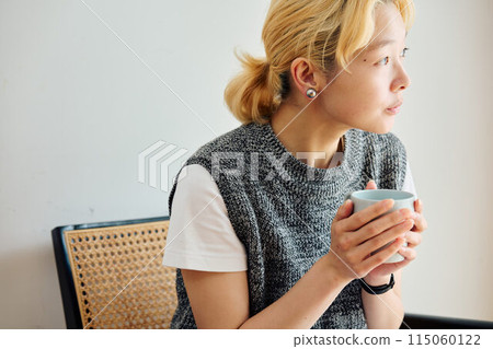 A woman relaxing in the room 115060122