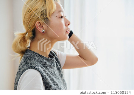 A woman relaxing in the room A woman relaxing in the room 115060134