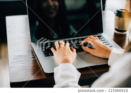 Happy beautiful freelancer typing keyboard on laptop, working online work outside office, Asian young businesswoman lifestyle sitting using laptop computer at cafe coffee shop Happy beautiful freelancer typing keyboard on laptop, working online work outside office, Asian young businesswoman lifestyle sitting using laptop computer at cafe coffee shop 115060428