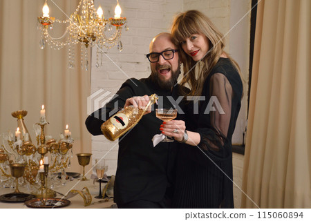 A large family with children posing in pajamas in New Year's locations. A large family with children posing in pajamas in New Year's locations. 115060894