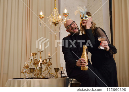 A large family with children posing in pajamas in New Year's locations. A large family with children posing in pajamas in New Year's locations. 115060898