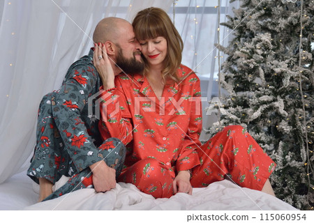 A large family with children posing in pajamas in New Year's locations. 115060954