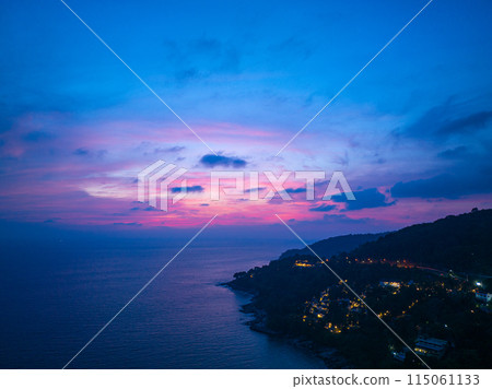 aerial view sweet pink Sunset is accompanied by clouds floating over the sea.. aerial view sweet pink Sunset is accompanied by clouds floating over the sea.. 115061133