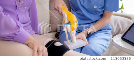 Caregiver or nurse helping check tendon and arthritis of knee or leg for diagnostic. Caregiver or nurse helping check tendon and arthritis of knee or leg for diagnostic. 115063586