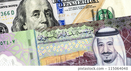 Saudi Arabia banknote with King Salman and American dollars banknote with Benjamin Franklin. Business concept of the exchange rate, stock exchange Saudi Arabia banknote with King Salman and American dollars banknote with Benjamin Franklin. Business concept of the exchange rate, stock exchange 115064048