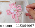 Japanese dressmaking (sewing on a haori ornament) 115064067